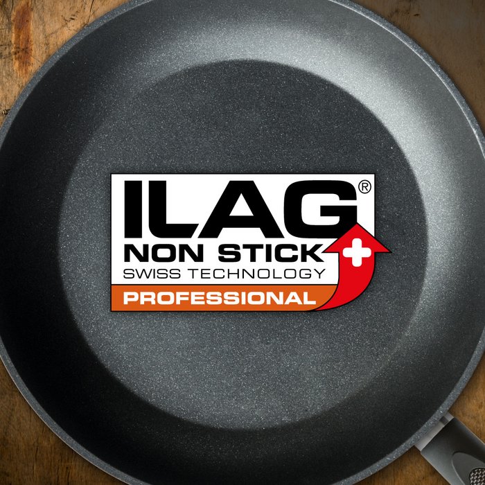 Black and with little flitter coated inside of a frying pan - ILAG logo with orange shaded Professional lettering in the center