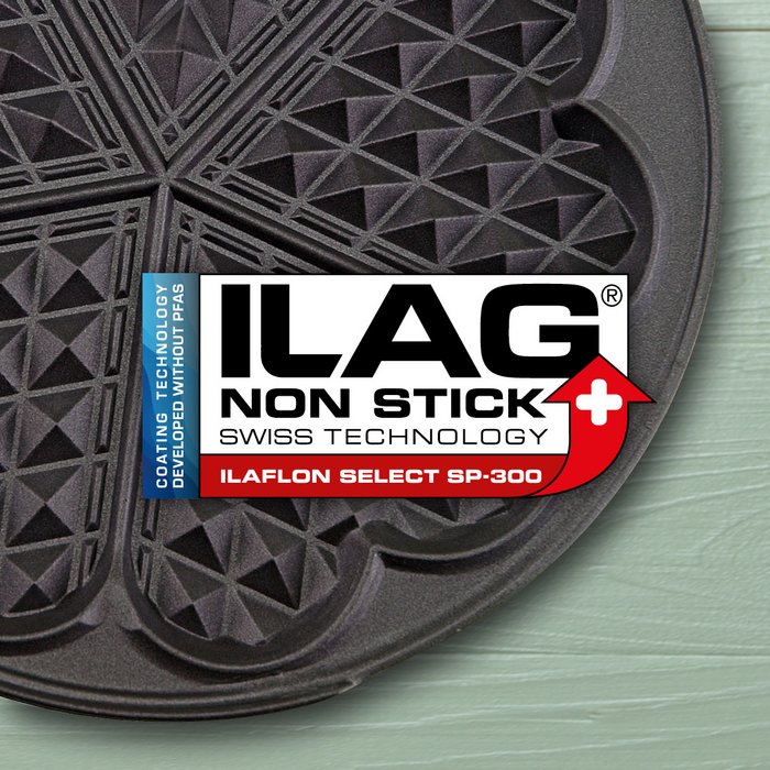 Black coated iron for heart shaped waffles - ILAG logo with red shaded Ilaflon Select SP-300 lettering in the center and on the left hand side an extra labeling "PFAS-FREE" in blue
